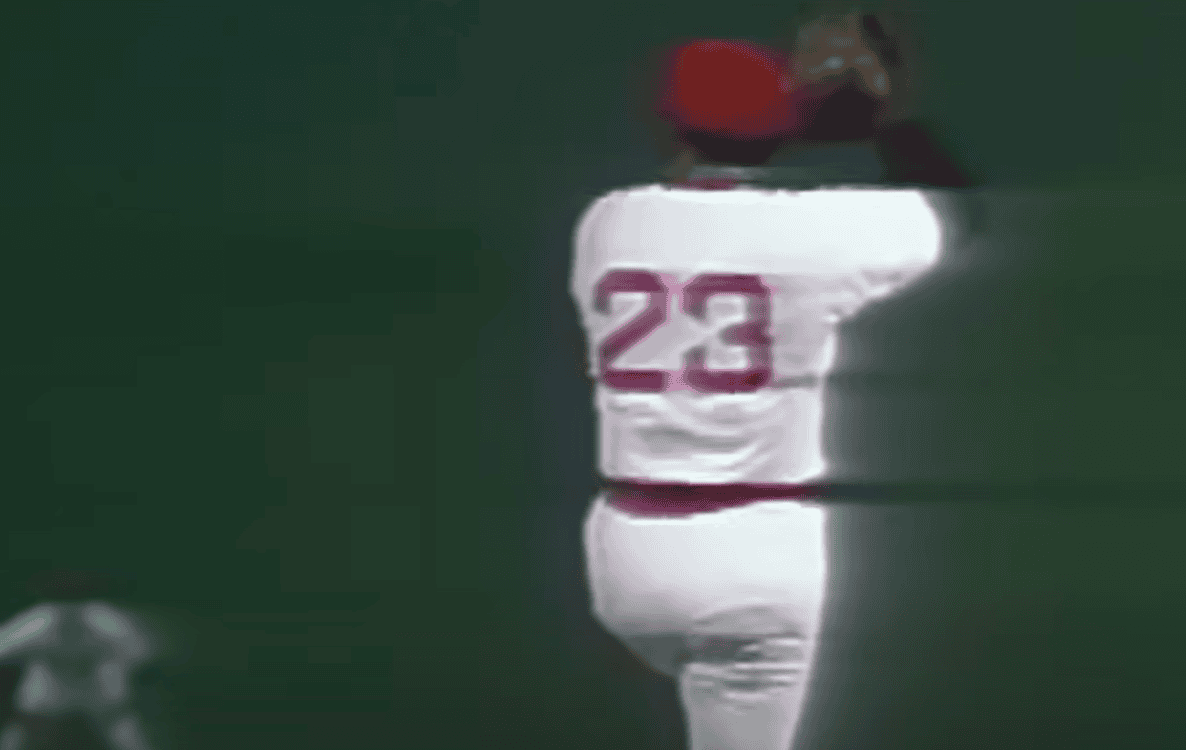 Luis Tiant delivering a pitch, showcasing his distinctive style as an iconic 1970s MLB pitcher.